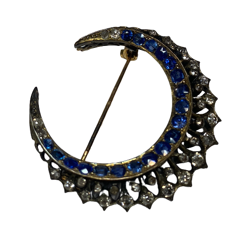 Brooch made of yellow gold, silver, sapphires, and diamonds