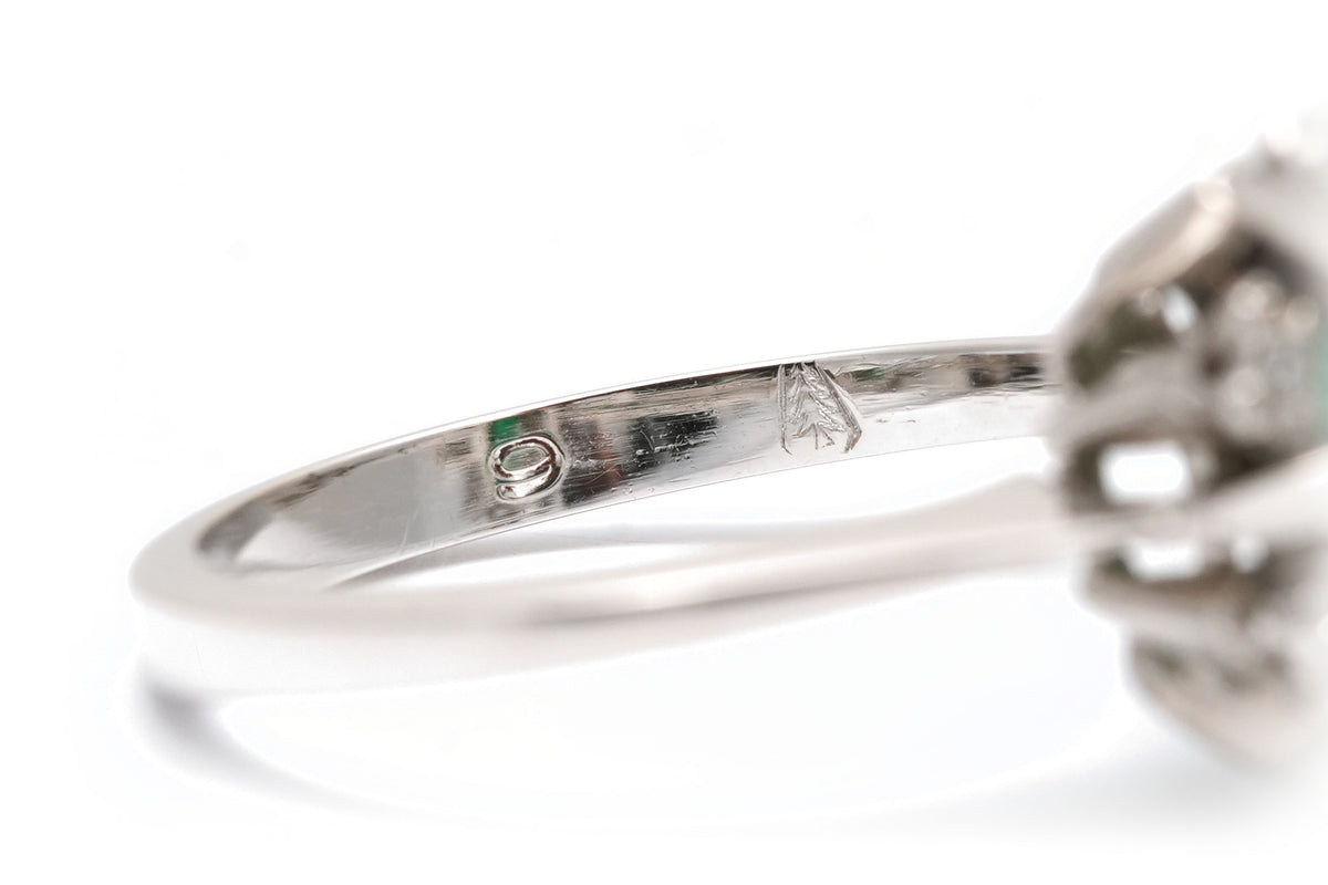"Entourage" Ring in White Gold, Emerald, and Diamonds