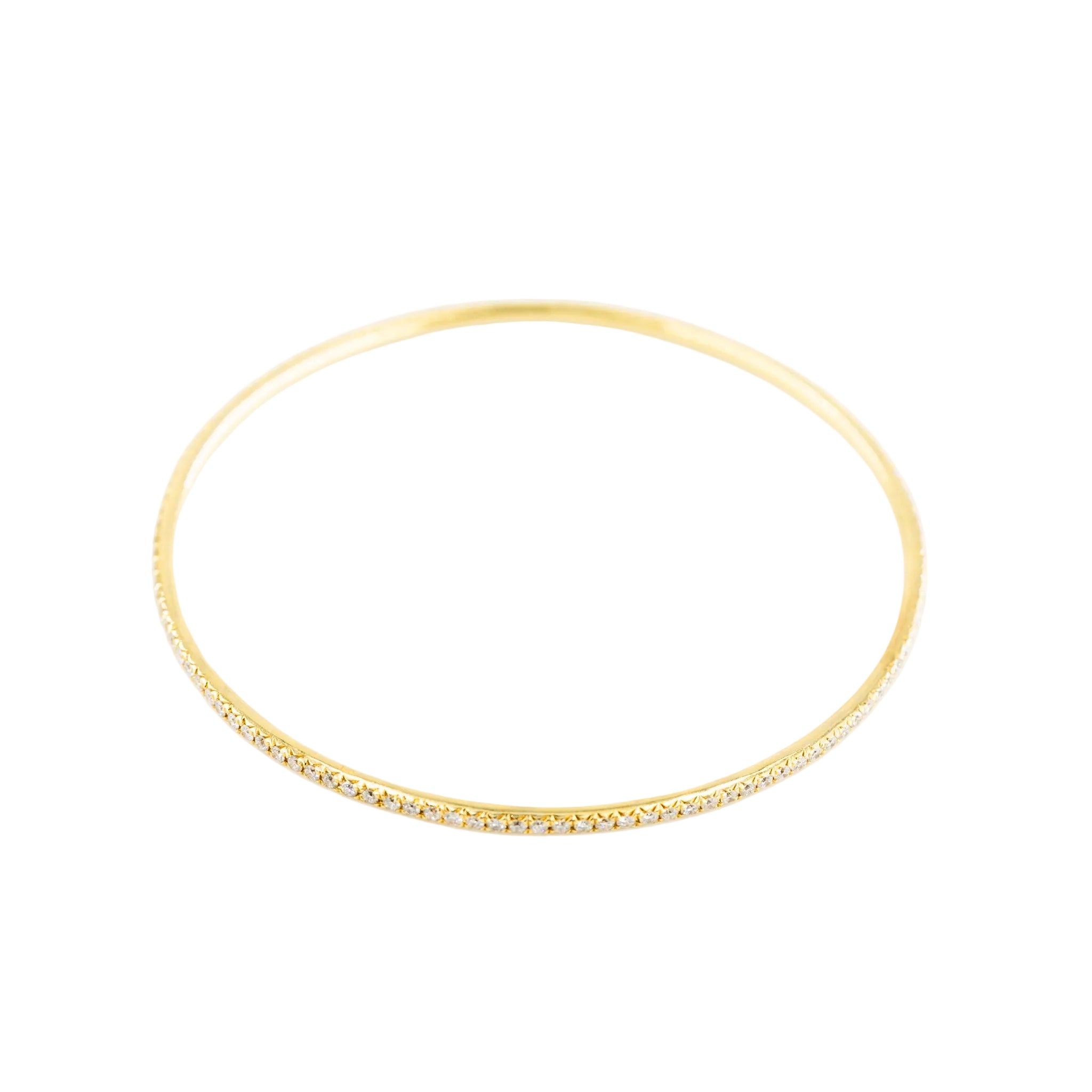 Three bangle bracelets in white gold, yellow gold, rose gold, and diamonds