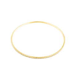 Three bangle bracelets in white gold, yellow gold, rose gold, and diamonds