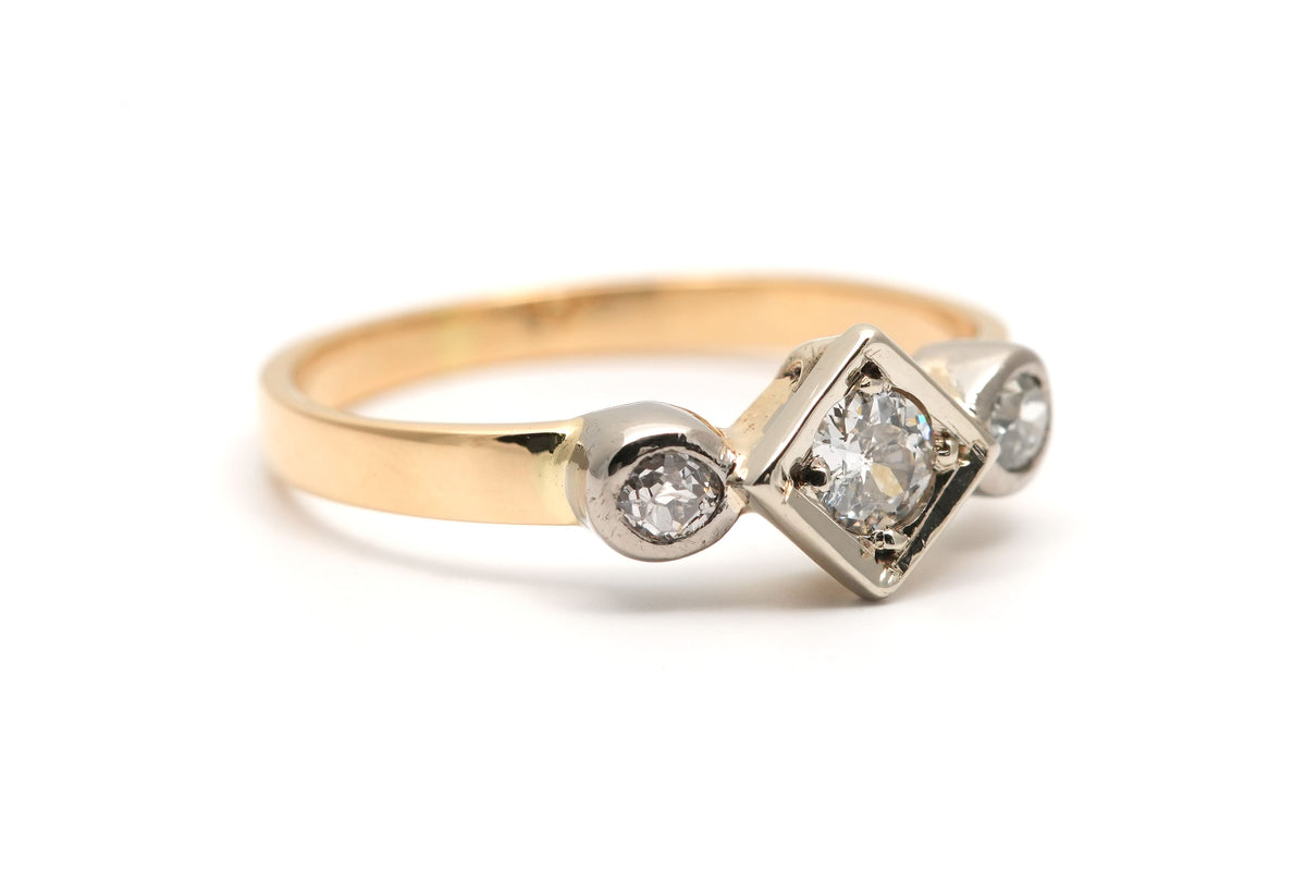 Trilogy Ring in White Gold, Yellow Gold, and Diamonds