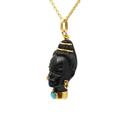 Yellow gold, ebony, and turquoise pendant