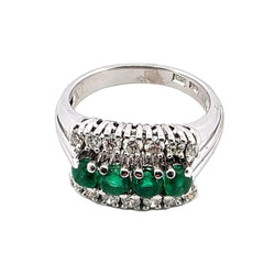 White gold ring with emeralds and diamonds