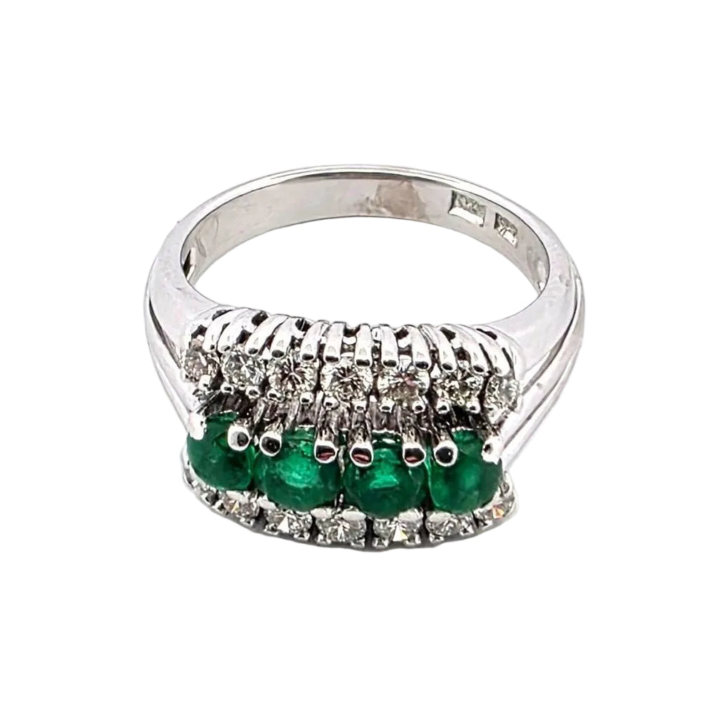 White gold ring with emeralds and diamonds