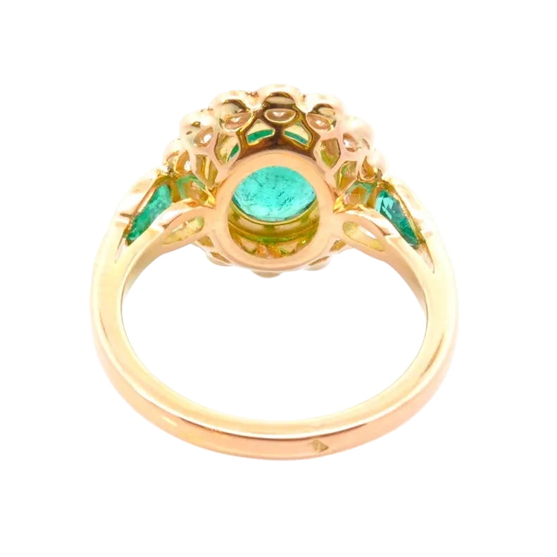 Entourage Ring in yellow gold, emeralds, and diamonds