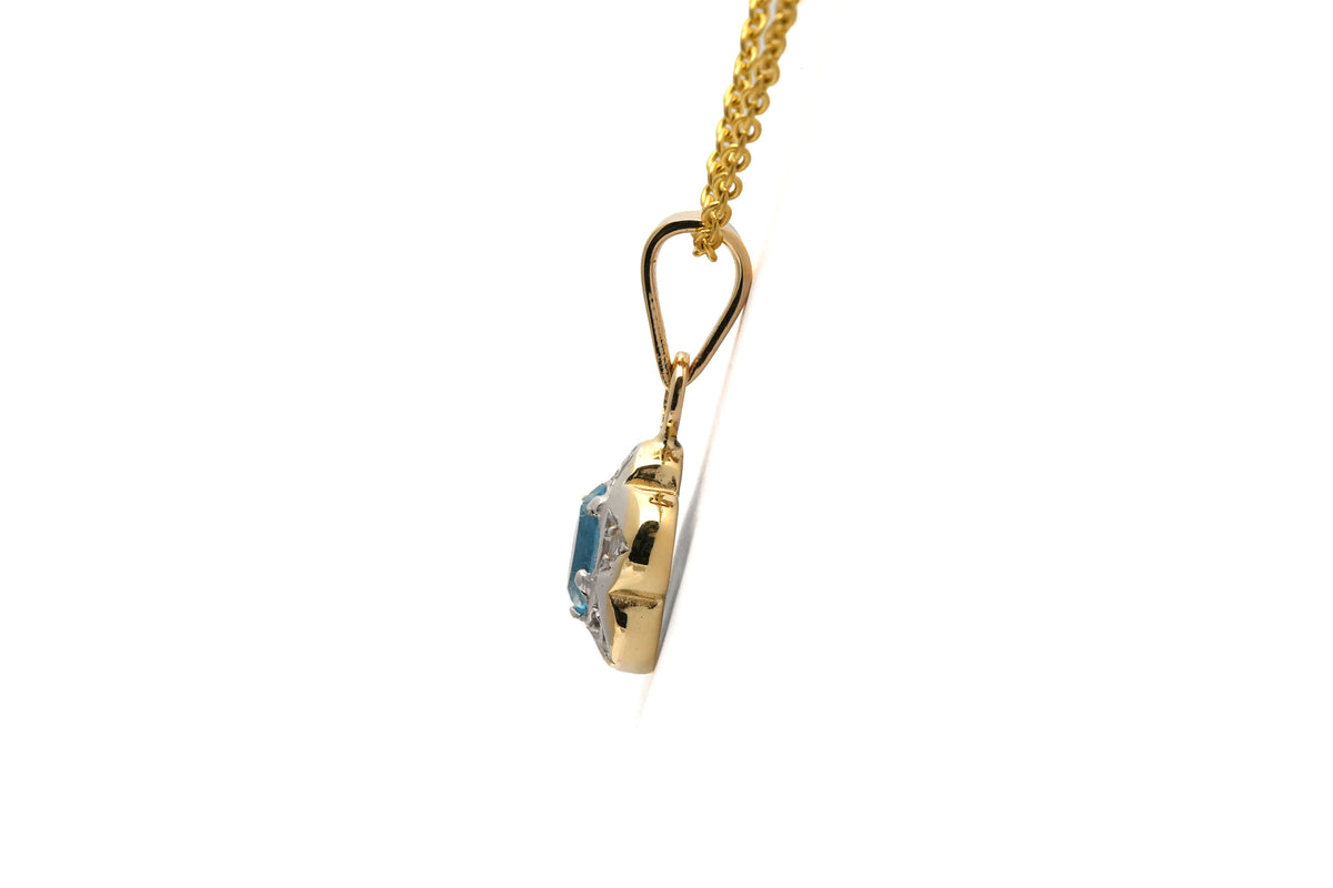 Pendant made of white gold, yellow gold, topaz, and diamonds