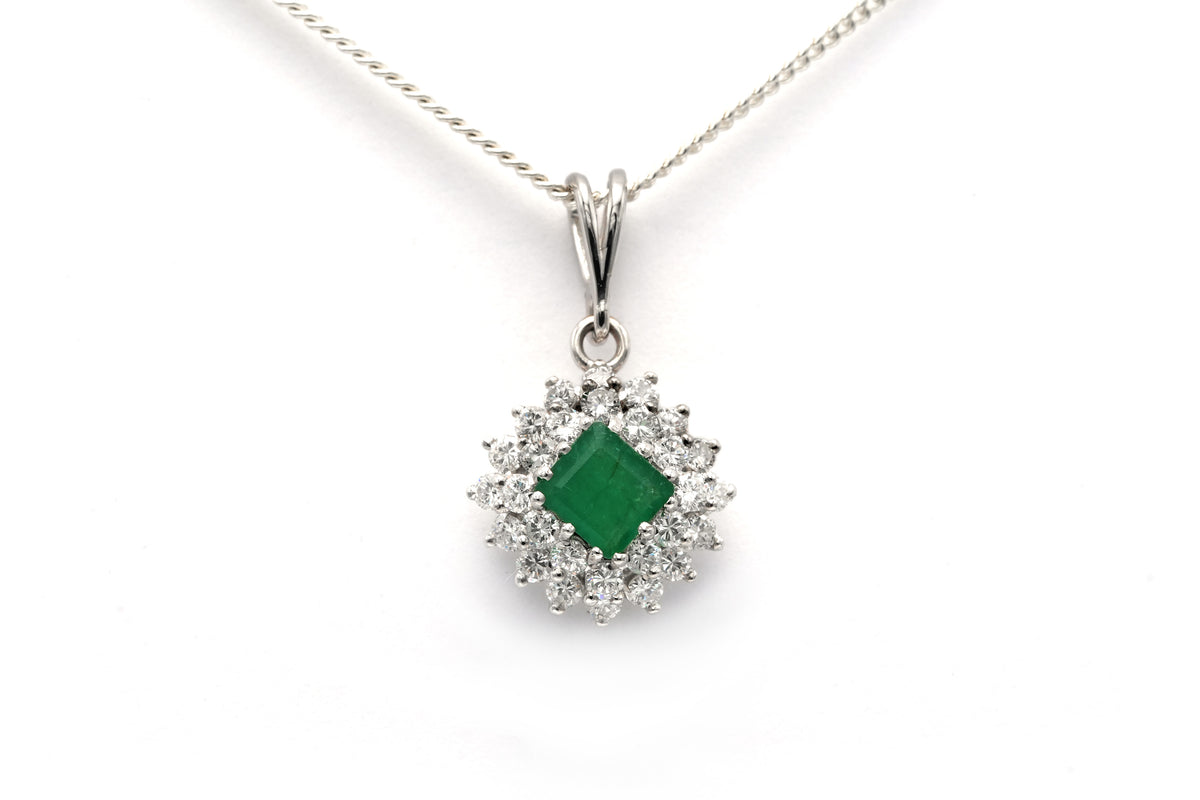 White gold pendant with emeralds and diamonds