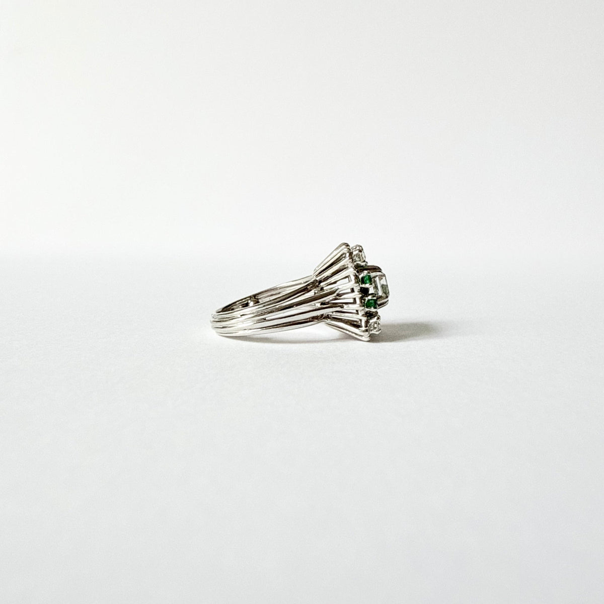 Marguerite Ring in White Gold, Emeralds, and Diamonds