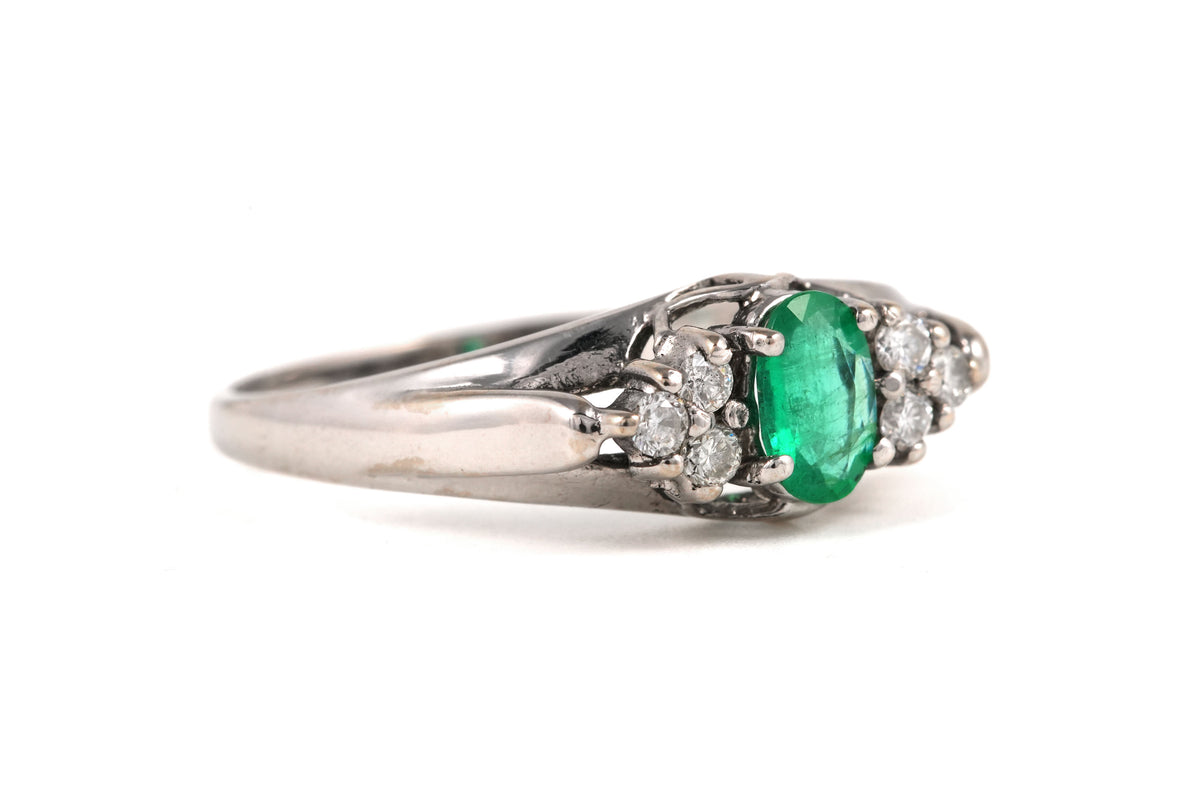 Trilogy Ring in White Gold, Emerald, and Diamonds