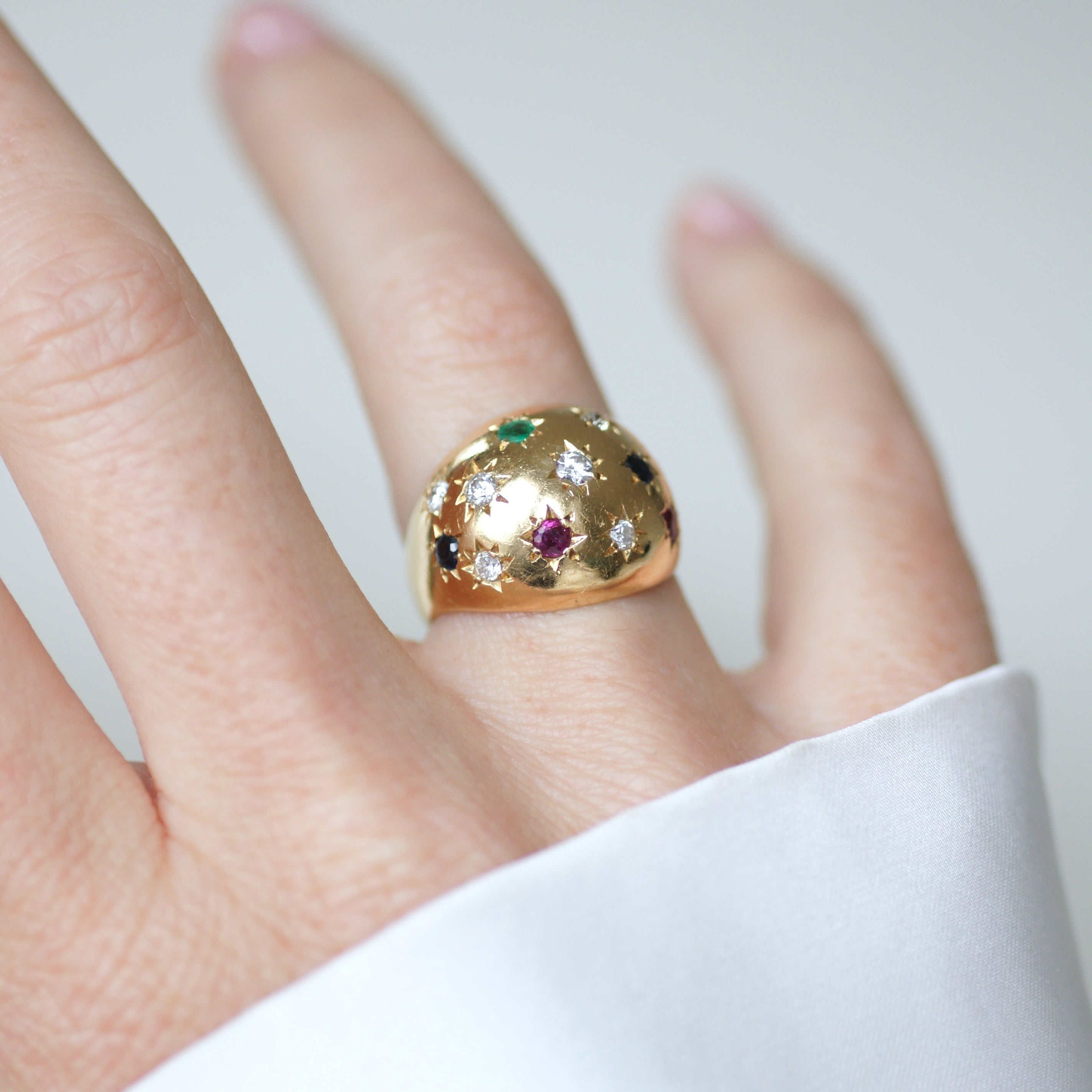 Ring in yellow gold, sapphires, emeralds, rubies, and diamonds