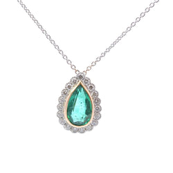 Necklace with a pendant in yellow gold, platinum, emerald, and diamonds