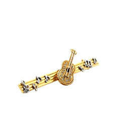 Brooch in yellow gold, white gold, and diamonds