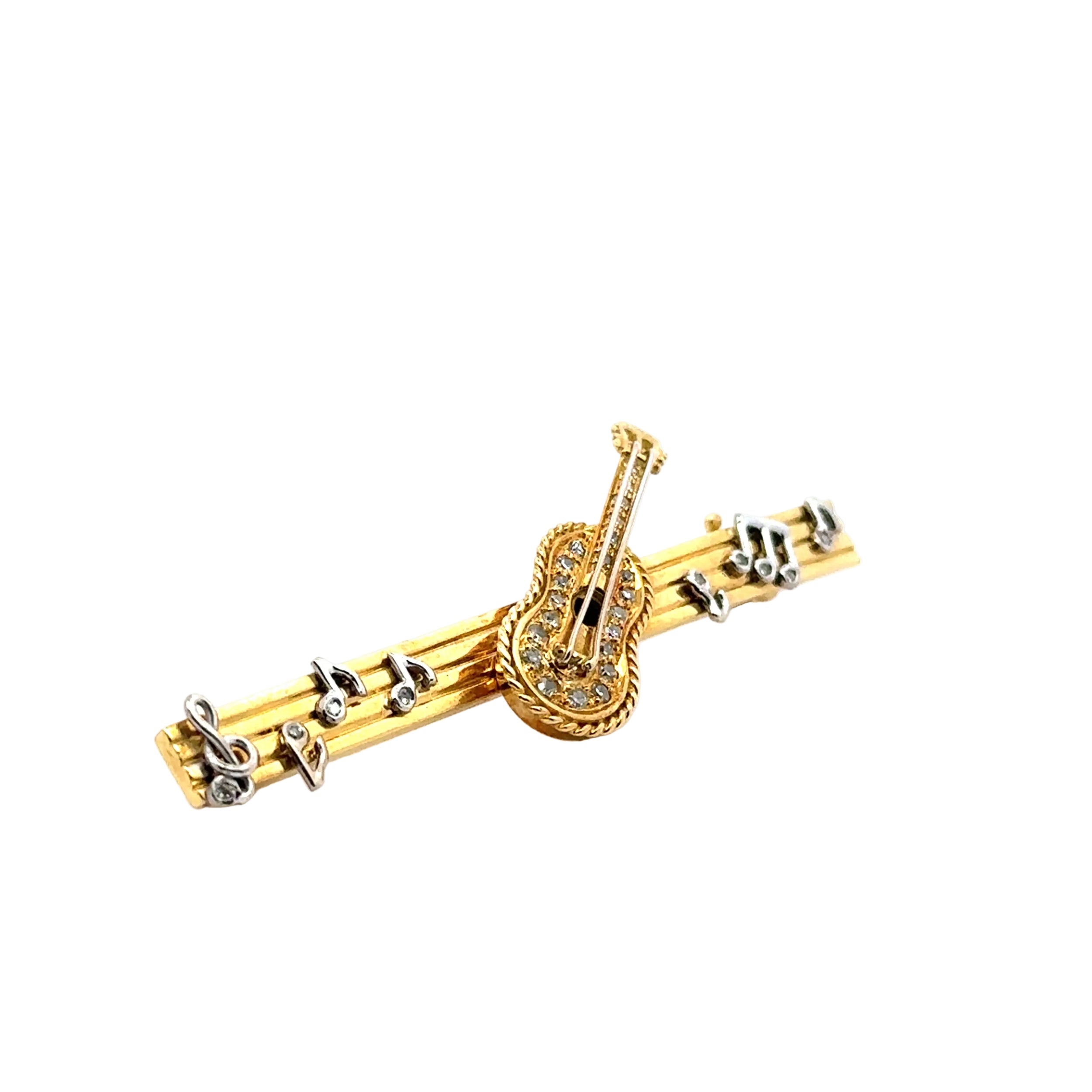 Brooch in yellow gold, white gold, and diamonds