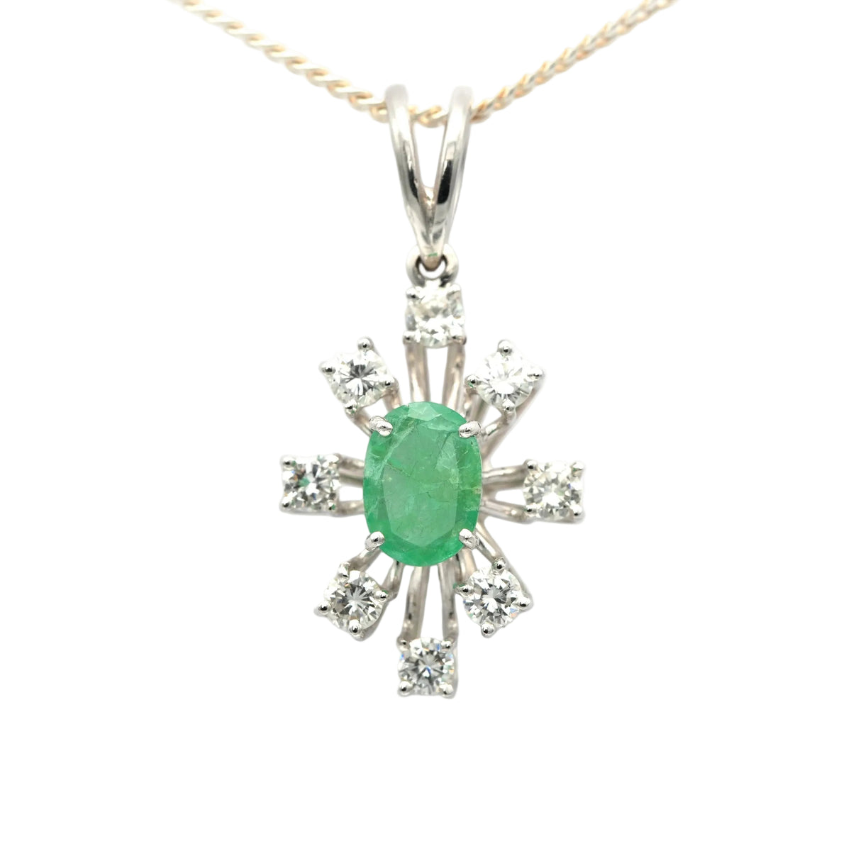 White gold pendant with emeralds and diamonds