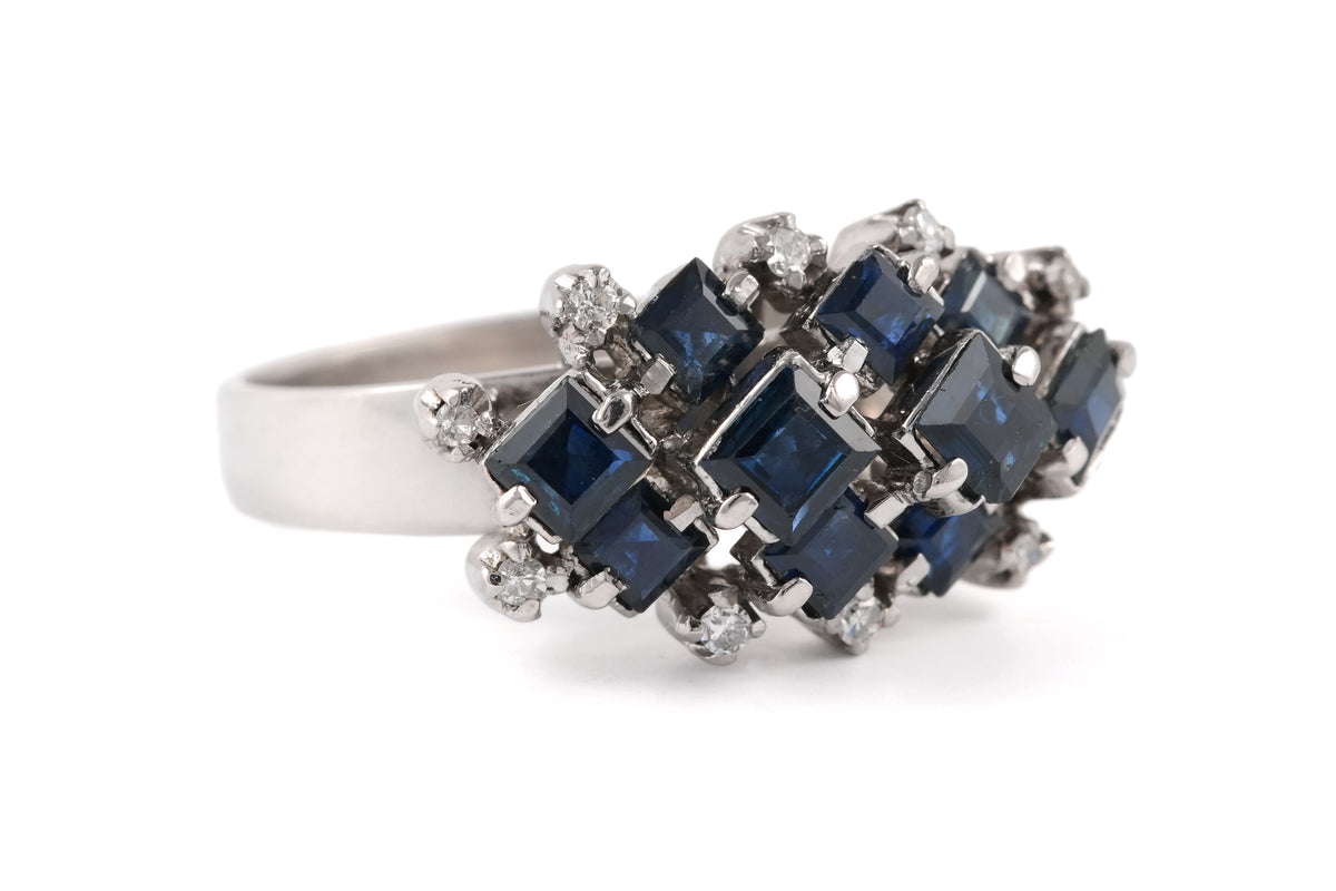 White gold ring with sapphires and diamonds