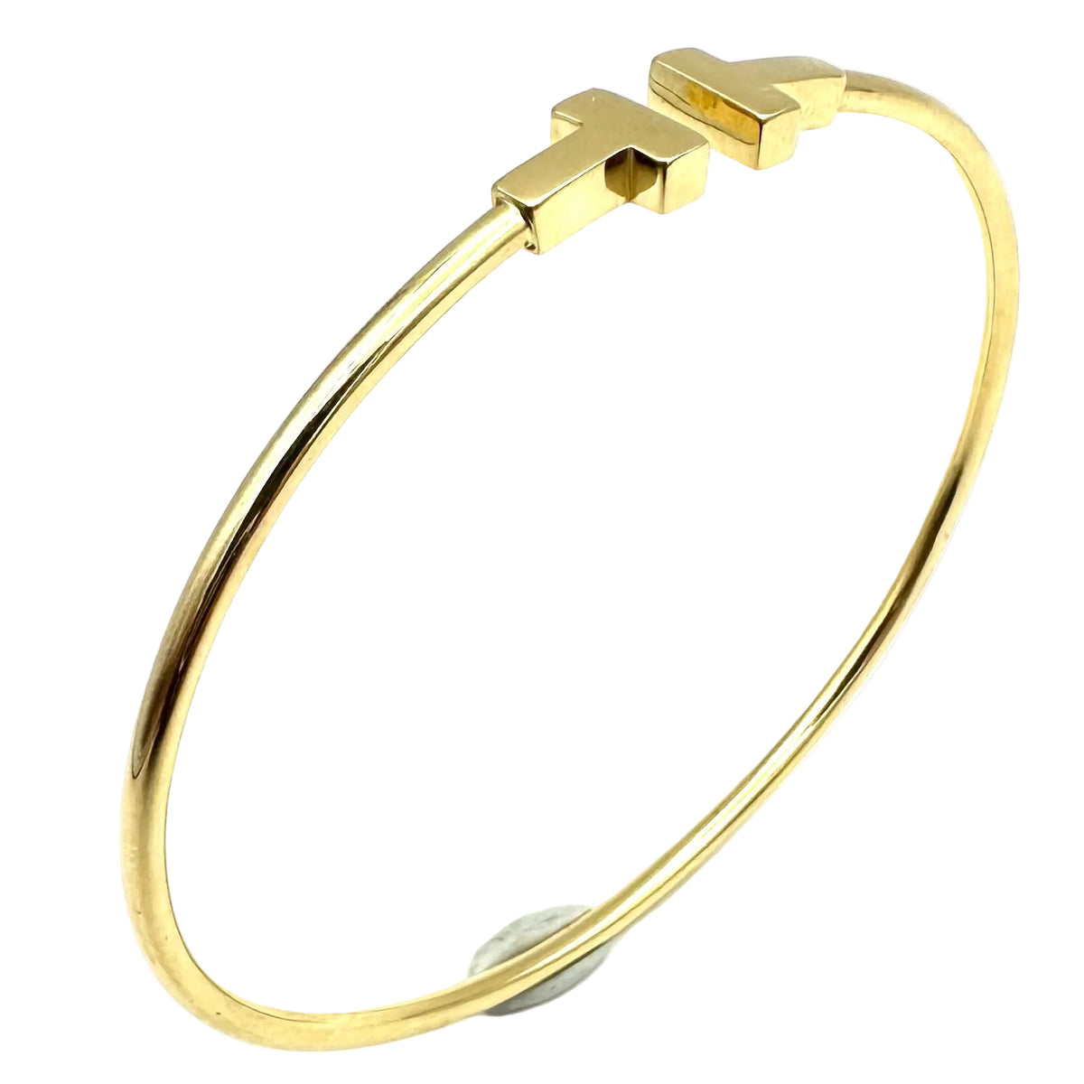 TIFFANY & CO. "Tiffany T" Yellow Gold Bangle