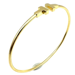 TIFFANY & CO. "Tiffany T" Yellow Gold Bangle