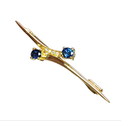 Broche croisée en or jaune, saphirs et diamants, vers 1960