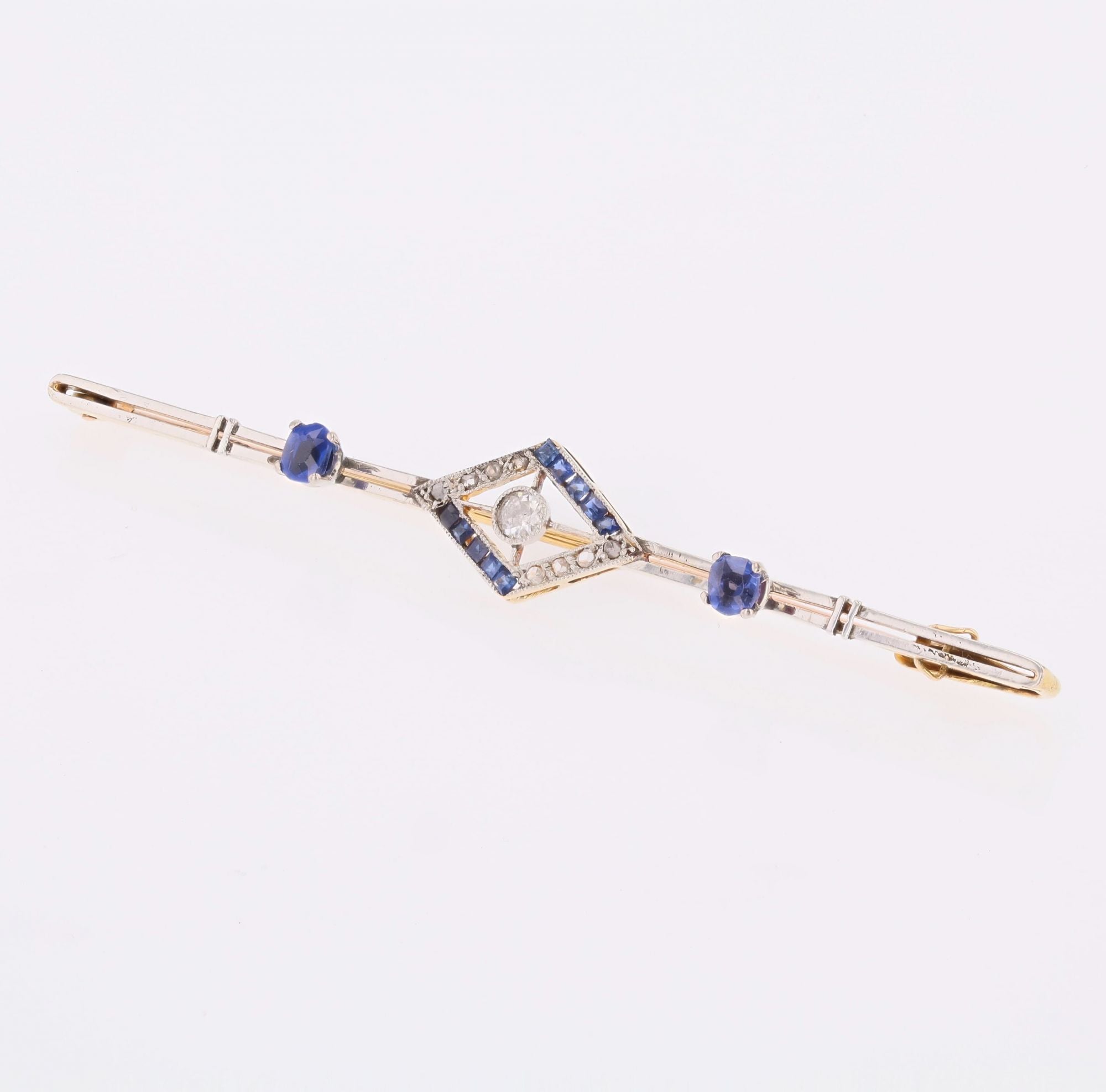Broche Barrette en or jaune, platine, saphirs et diamants