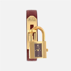 Montre HERMÈS Kelly en métal plaqué or et cuir