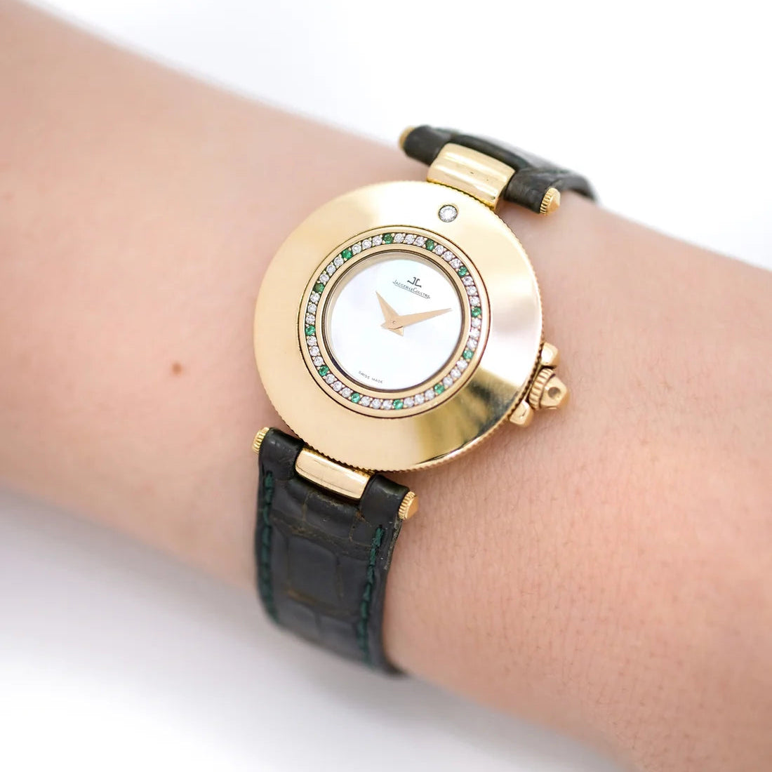 JAEGER-LECOULTRE watch in yellow gold, Mother-of-pearl, leather, emeralds, and diamonds