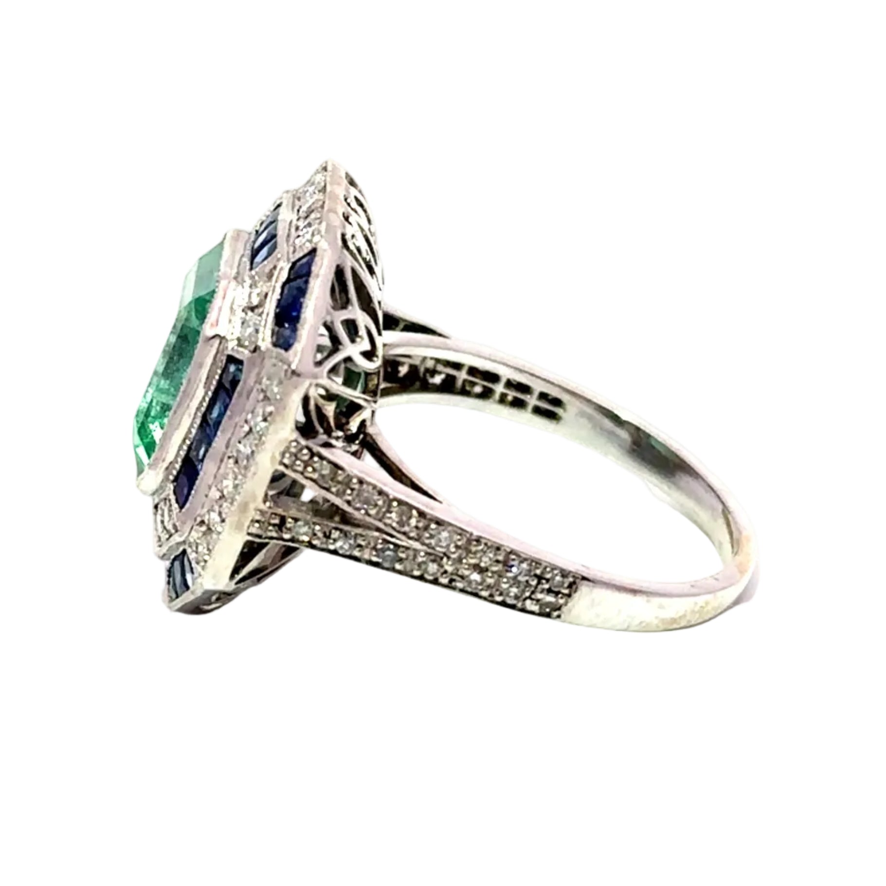Entourage Ring in white gold, emerald, sapphire, and diamonds