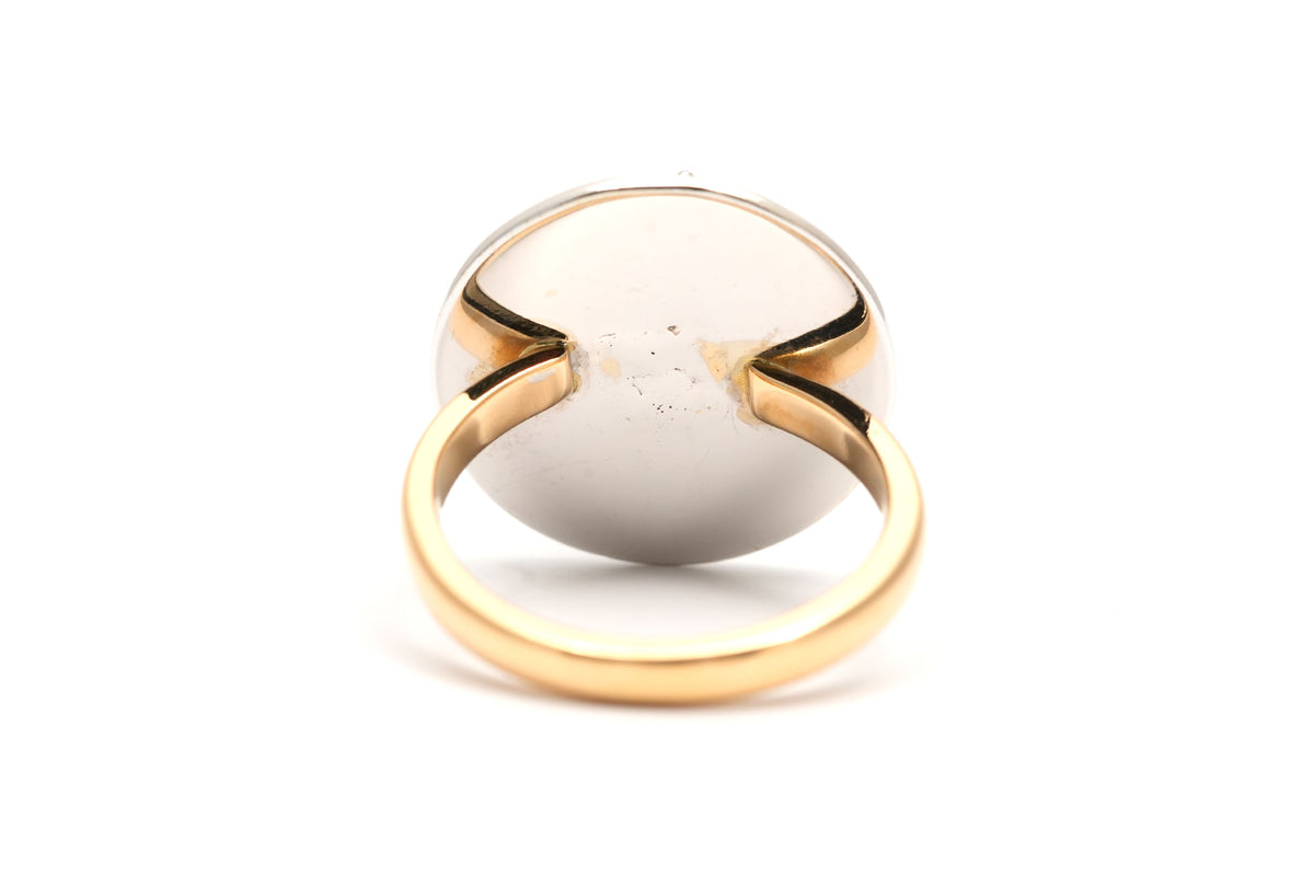 Ring in white gold, yellow gold, emeralds, and diamonds
