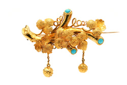 Broche Épingle en or jaune et turquoises