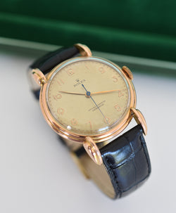 ROLEX "Chronometer" watch in rose gold, steel, and leather