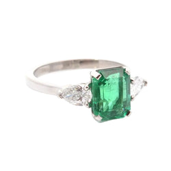 Trilogy Ring in Platinum, Emerald, and Diamonds
