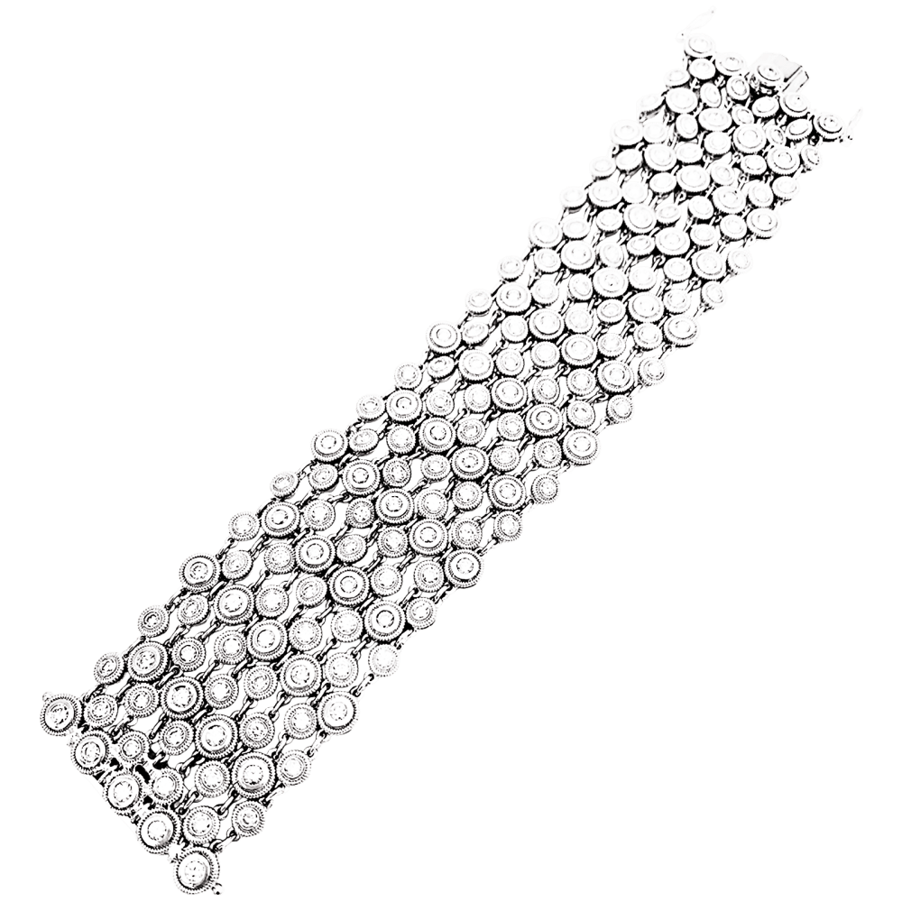 Bracelet souple, or blanc et diamants.