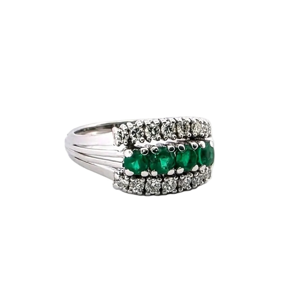 White gold ring with emeralds and diamonds