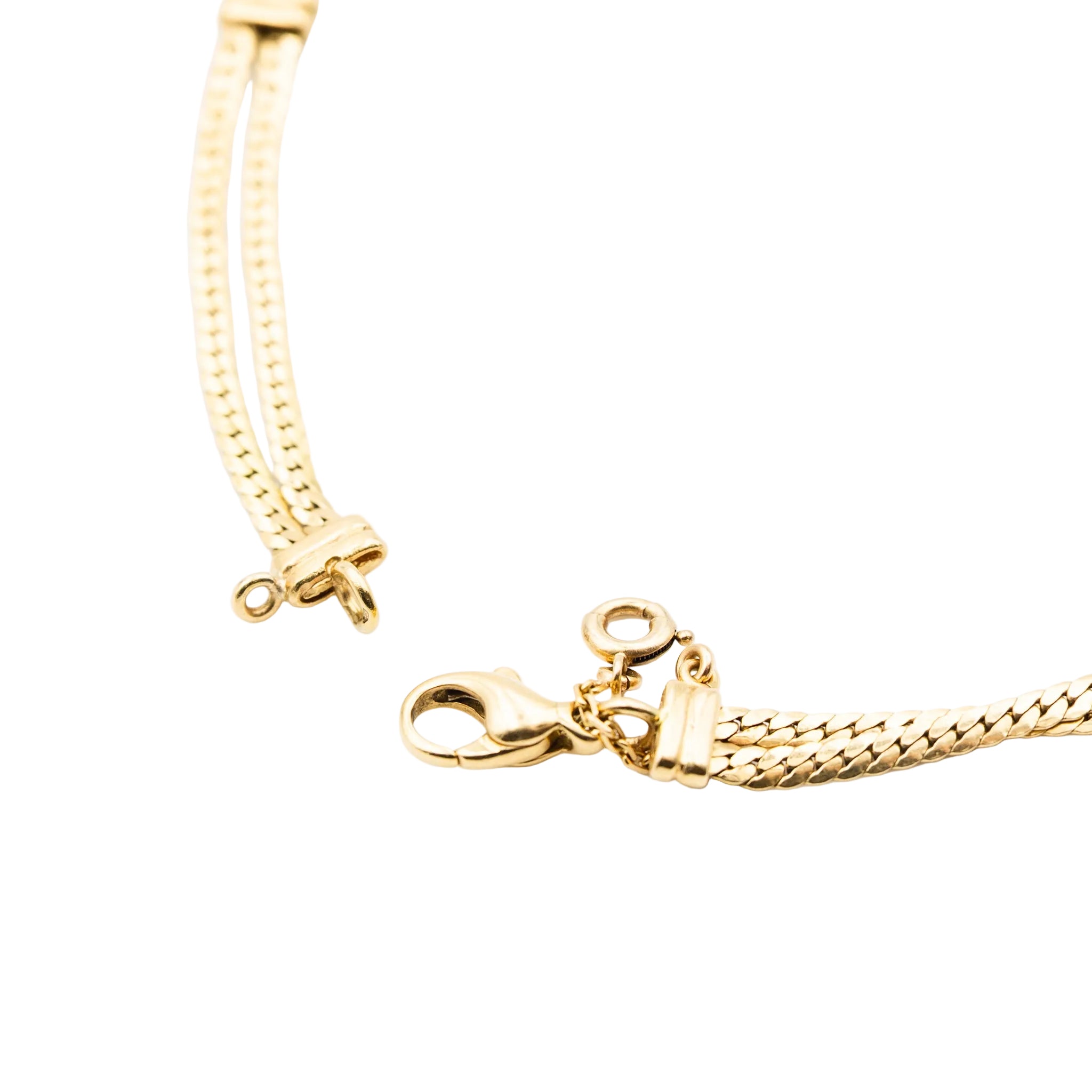 Necklace in yellow gold, citrines, garnets, peridots, blue topaz, pink tourmalines, rubies and diamonds.