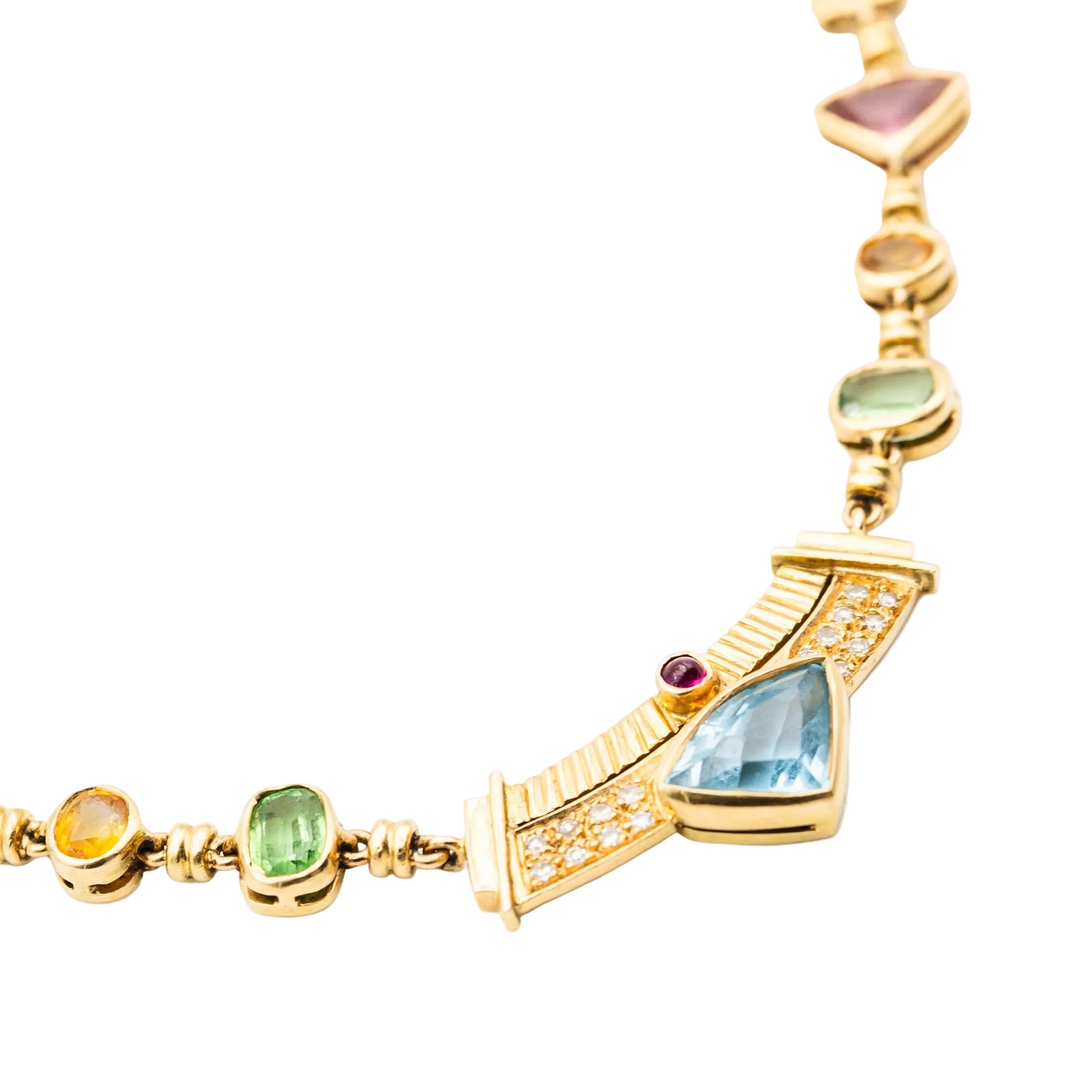 Necklace in yellow gold, citrines, garnets, peridots, blue topaz, pink tourmalines, rubies and diamonds.