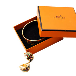 Bracelet and HERMÈS ear clips in gilded metal and enamel