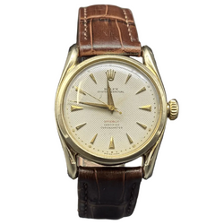 ROLEX "Oyster Perpetual 34" watch in yellow gold and leather