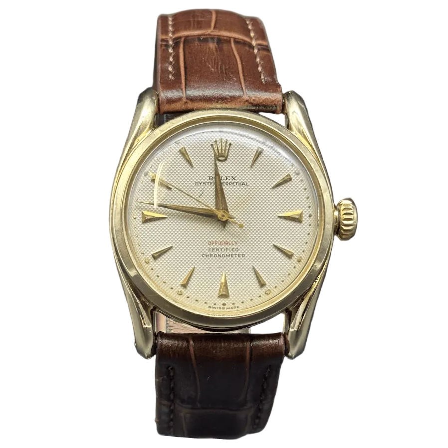 ROLEX "Oyster Perpetual 34" watch in yellow gold and leather