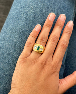 Bandeau ring in yellow gold with emerald and diamonds