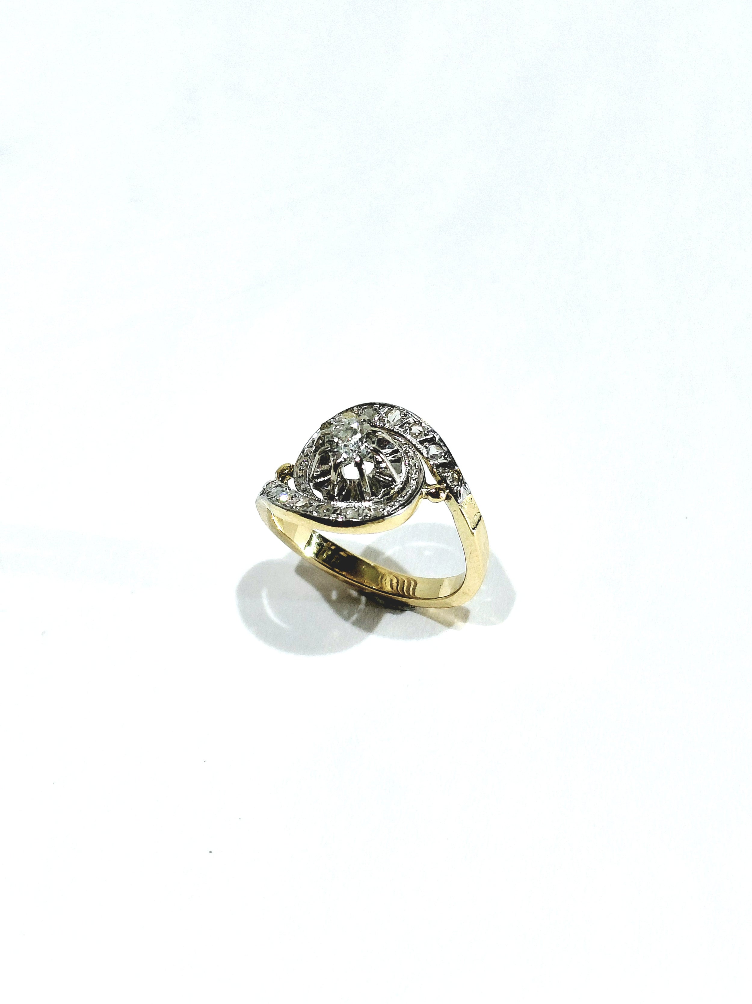 Tourbillon ring in yellow gold, white gold, and diamonds
