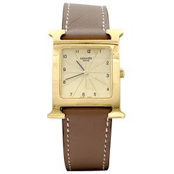 Montre Hermès, "Heure H", plaqué or, acier.
