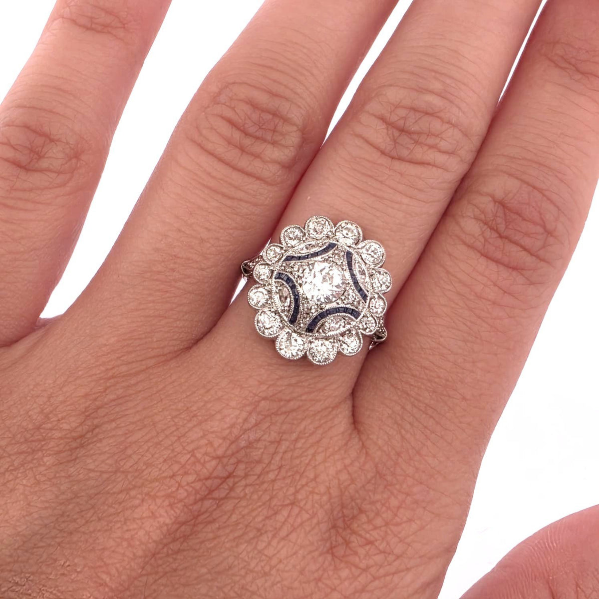 Entourage Ring in platinum, sapphires, and diamonds
