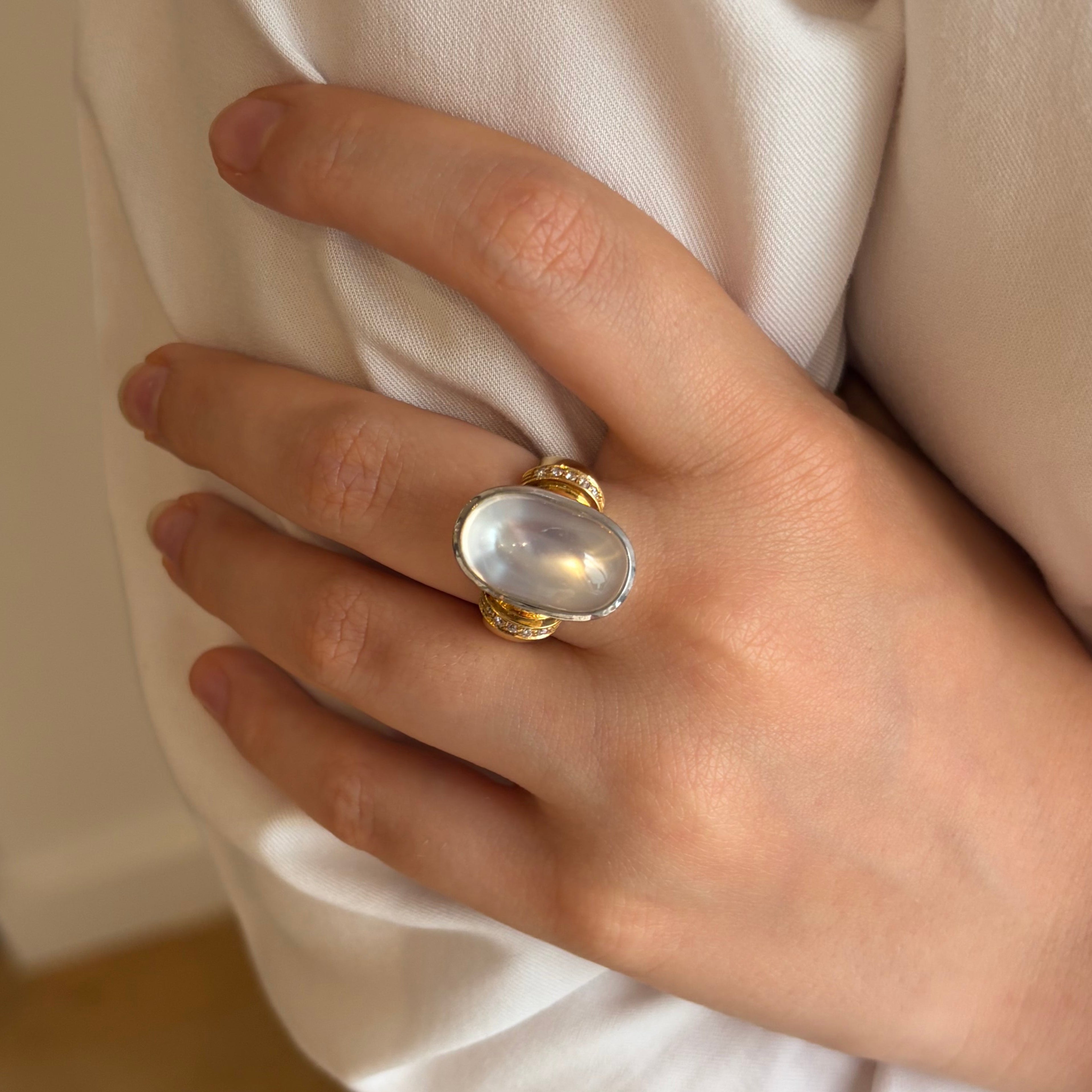 Solitaire Ring in yellow gold, white gold, moonstone, and diamonds