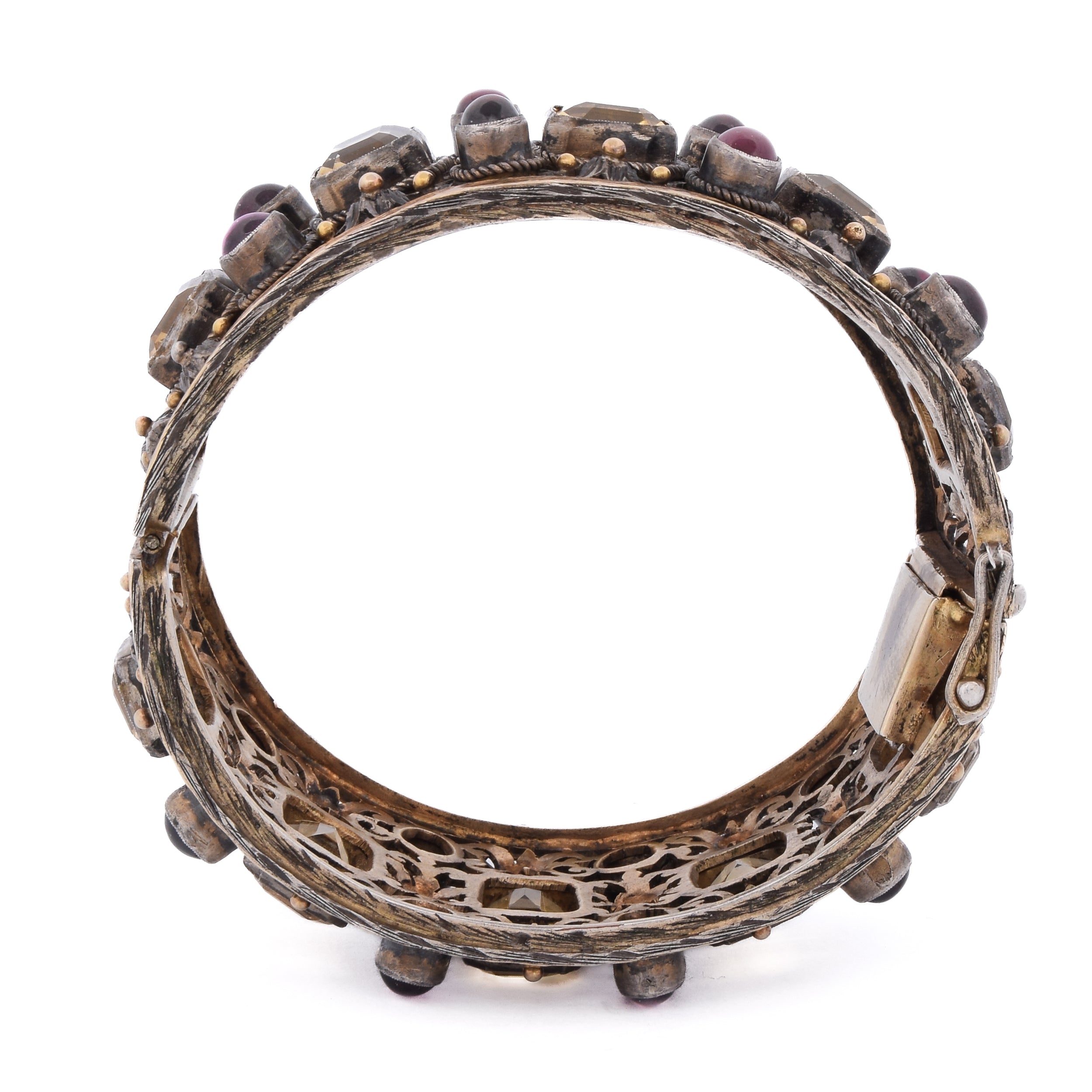 Cuff bracelet in yellow gold, silver, beryls, and garnets