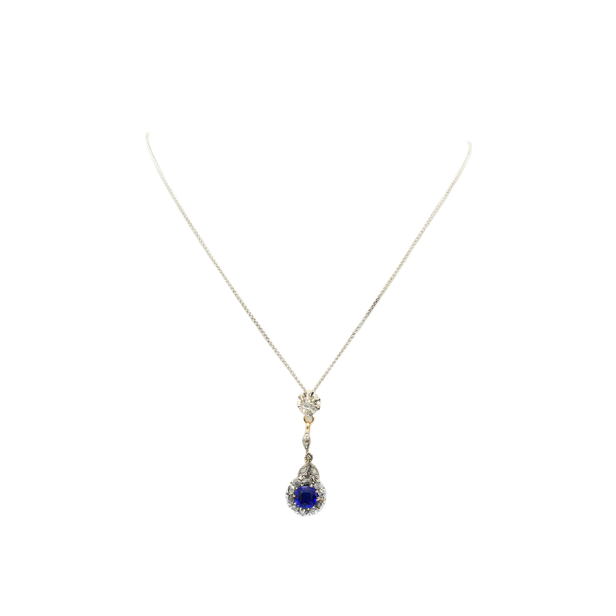 Necklace with a pendant made of yellow gold, silver, sapphire, and diamonds