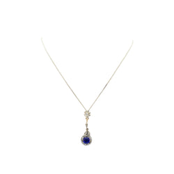 Necklace with a pendant made of yellow gold, silver, sapphire, and diamonds