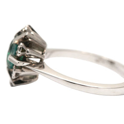 "Entourage" Ring in White Gold, Emerald, and Diamonds