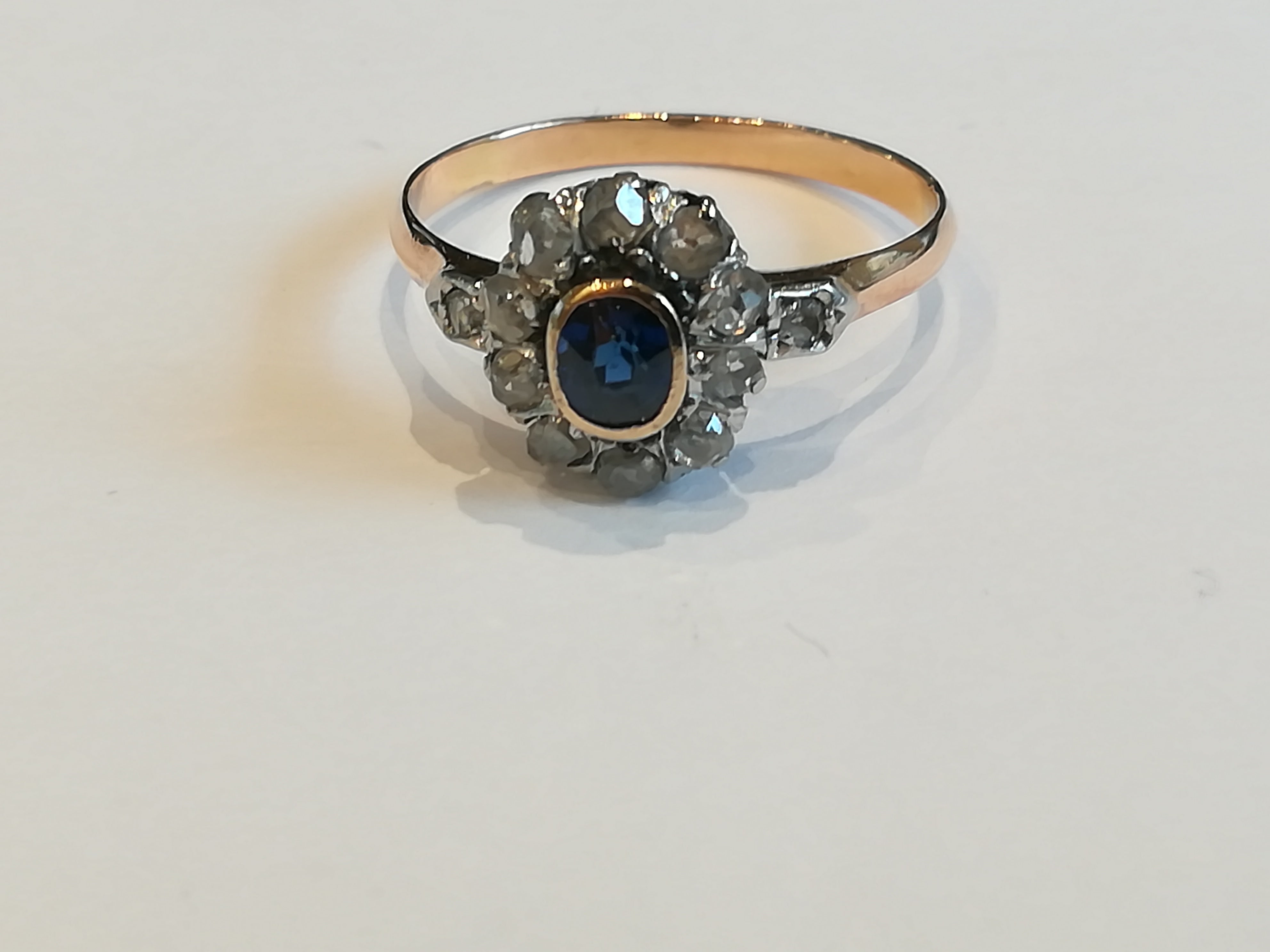 Ring in pink, paltinium, sapphire and diamonds.