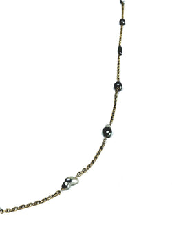 Rose gold long necklace with Tahitian pearls.