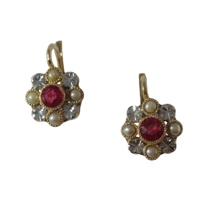 Dormeuses earrings in yellow gold, bank gold, rubies, and pearls