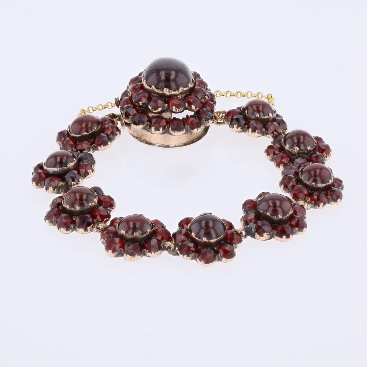 Yellow gold, silver, and garnet bracelet